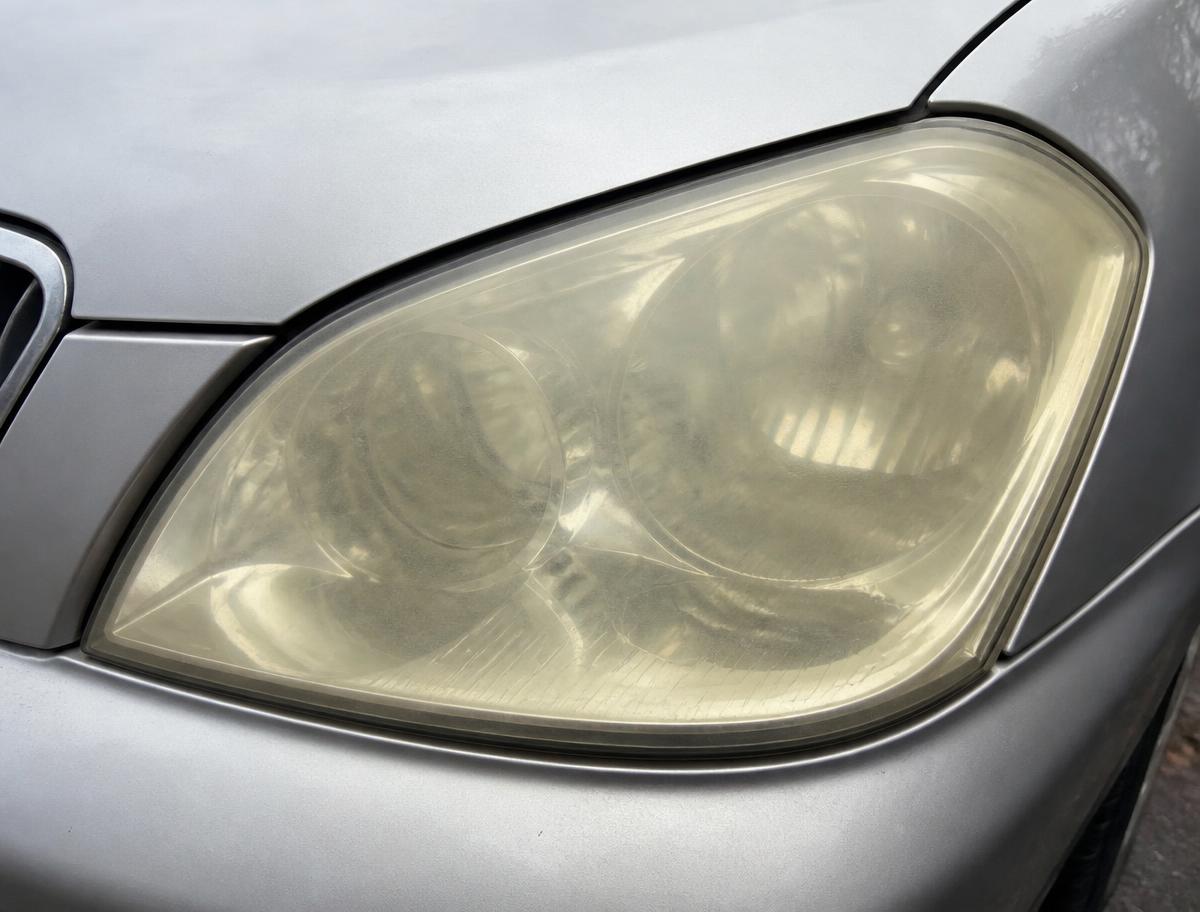 Cloudy yellow headlight before restoration in Sheboygan WI